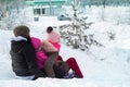 girls and mom slide down the hill Royalty Free Stock Photo