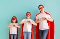 Girls and mom in Superhero costumes Royalty Free Stock Photo