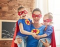 Girls and mom in Superhero costumes Royalty Free Stock Photo