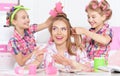 Girls with mother in hair curlers