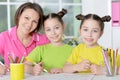 Girls with mother on lesson of art Royalty Free Stock Photo