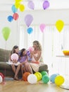 Girls And Mother In Room Full Of Balloons