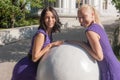 Girls near the stone sphere