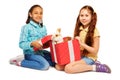 Girls open red present box with real bunny Royalty Free Stock Photo