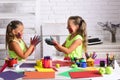 Girls painters painting with gouache paints on table Royalty Free Stock Photo