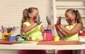 Girls painters painting with gouache paints on table Royalty Free Stock Photo