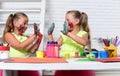 Girls painters painting with gouache paints on table Royalty Free Stock Photo