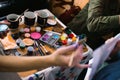 Girls painting faces to children a master class at the opening of a children`s center in Cherkasy, Ukraine, March 23, 2018