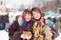 Girls with pancake during Shrovetide