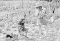 Girls planting plants. Agriculture concept. Growing vegetables. Rustic children working in garden. Planting and watering Royalty Free Stock Photo