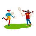 Girls play badminton. Badminton rackets and shuttlecock. Outdoor sports games