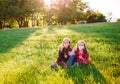 Girls play with soap bubbles in a spring time. Royalty Free Stock Photo