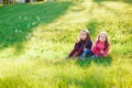 Girls play with soap bubbles in a spring time. Royalty Free Stock Photo