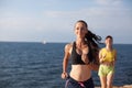 Girls play sports running around on the Beach Royalty Free Stock Photo