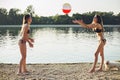 Girls playing with ball on the beach Royalty Free Stock Photo