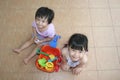 Girls playing beach playset