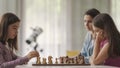 Girls playing chess together at home Royalty Free Stock Photo