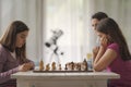 Girls playing chess together at home Royalty Free Stock Photo