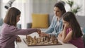 Girls playing chess together at home Royalty Free Stock Photo