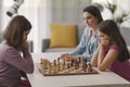 Girls playing chess together at home Royalty Free Stock Photo