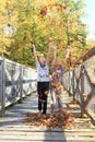 Girls playing with fallen leaves Royalty Free Stock Photo