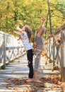 Girls playing with fallen leaves Royalty Free Stock Photo