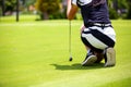 Girls are playing golf on a sunny day on the beautiful green golf course. Royalty Free Stock Photo