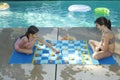 Girls Playing Large Draughts Board
