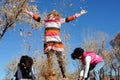 Girls playing in leaves