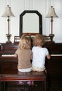 Girls Playing Piano Royalty Free Stock Photo