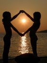 Girls playing in sunset