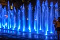 Girls playing in water fountain at night in Quebec city Royalty Free Stock Photo