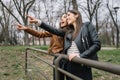 Girls pointing with finger far away in the park Royalty Free Stock Photo