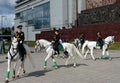 Girls - police cavalrymen demonstrate dressage on the Prospect Mira in Moscow. Royalty Free Stock Photo