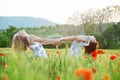 Girls in poppy field Royalty Free Stock Photo