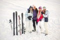 Girls posing against backdrop of mountains in ski gear. Royalty Free Stock Photo