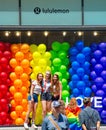 Girls posing in front of the Lululemon during the 2018 New York City Pride Parade.