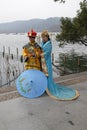 Girls posing in traditional Chinese costumes on the shores of West Lake in Hangzhou, China