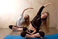 Girls practicing yoga in room