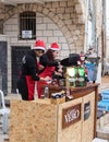 Girls prepare coffee at the finish for participants of the annua