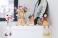 Girls and puppy dolls on a white table, home decorative.