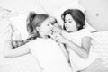 Girls relaxing on bed. Slumber party concept. Girls just want to have fun. Invite friend for sleepover. Best friends Royalty Free Stock Photo