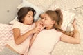 Girls relaxing on bed. Slumber party concept. Girls just want to have fun. Invite friend for sleepover. Best friends Royalty Free Stock Photo