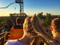 Girls riding a rollercoaster