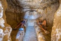 Girls in rock caves on famous Matala beach, Crete, Greece Royalty Free Stock Photo