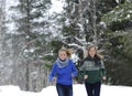 Girls run on the forest path