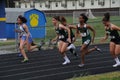 Girls run in a high school track meet Royalty Free Stock Photo