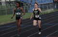 Girls run in a high school track meet Royalty Free Stock Photo