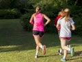 Girls running in bright sunlight