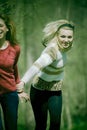 Girls running in the forest